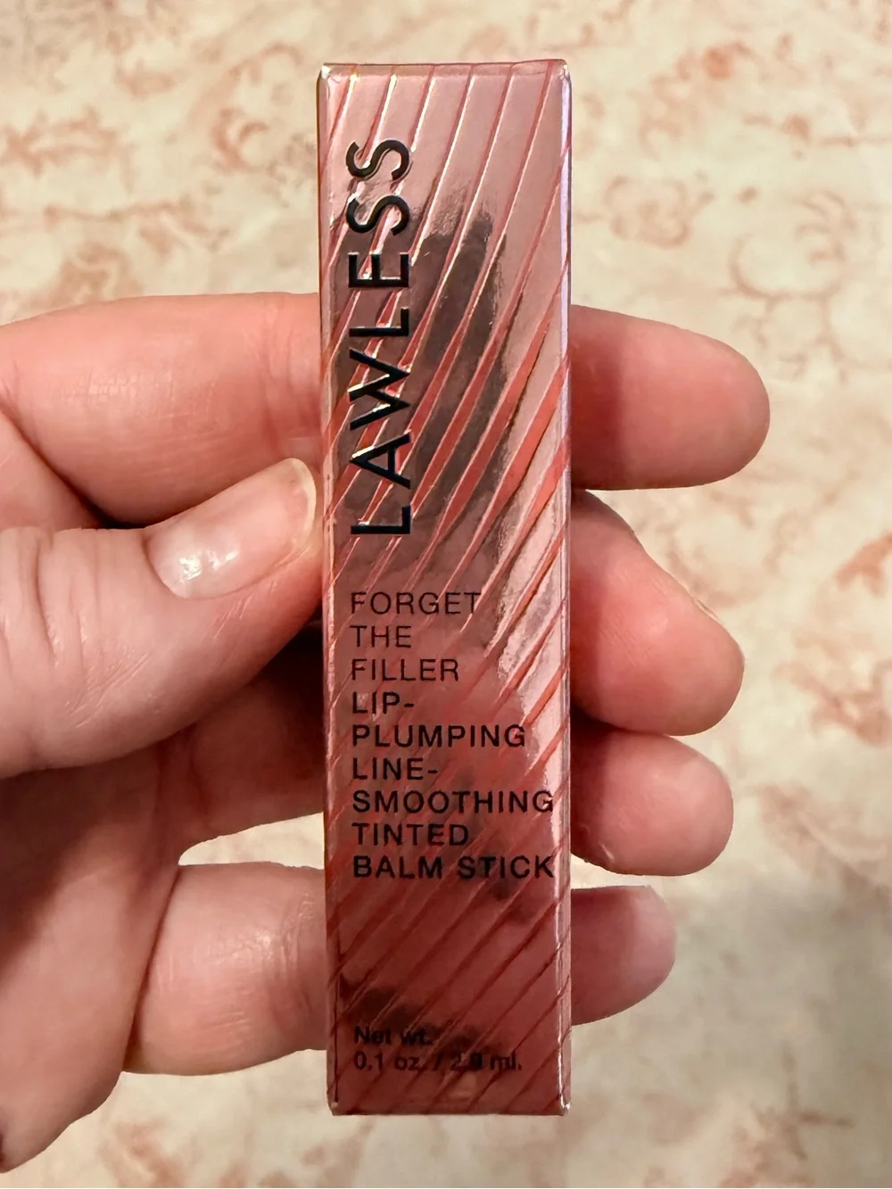 Lawless Forget the Filler Lip-Plumping Tinted Lip Balm in shade Baby Doll